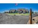 Charming home featuring mature landscaping, an American flag, and a circular driveway at 55610 E 40Th Ave, Strasburg, CO 80136