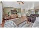 Cozy living room with a large flat-screen TV and comfortable seating arrangements at 55610 E 40Th Ave, Strasburg, CO 80136