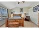 Spacious main bedroom with a large window, carpet, and comfortable furnishings at 55610 E 40Th Ave, Strasburg, CO 80136