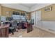 Well-lit home office with neutral carpet, a large window, and ample space for working from home at 55610 E 40Th Ave, Strasburg, CO 80136
