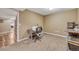 Home office space with neutral paint, a desk area, carpet floors and extra space at 55610 E 40Th Ave, Strasburg, CO 80136