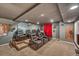 Home theater room with comfortable seating, tiered levels, and a large screen at 55610 E 40Th Ave, Strasburg, CO 80136