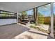 Covered stone patio, wooden deck, trees, and lawn, perfect for outdoor living at 10508 W Chautauga Mtn, Littleton, CO 80127