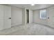 Finished basement showcasing neutral paint, plush carpet, closet, and window with bright, natural light at 10508 W Chautauga Mtn, Littleton, CO 80127