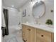Bathroom with vanity, toilet and tub shower with grey shower curtain at 10508 W Chautauga Mtn, Littleton, CO 80127