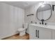Updated bathroom featuring modern vanity, stylish mirror and new fixtures at 10508 W Chautauga Mtn, Littleton, CO 80127