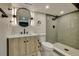 Updated bathroom features modern vanity, stylish mirror and enclosed glass shower at 10508 W Chautauga Mtn, Littleton, CO 80127