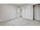 Bedroom features plush carpet, neutral paint, a closet with sliding doors, and access to other rooms at 10508 W Chautauga Mtn, Littleton, CO 80127