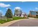 Inviting front yard with mature trees and professional landscaping at 10508 W Chautauga Mtn, Littleton, CO 80127