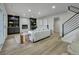 Inviting living room with stone fireplace and staircase access at 10508 W Chautauga Mtn, Littleton, CO 80127