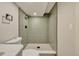 Modern bathroom with tiled shower, black hardware and updated fixtures at 10508 W Chautauga Mtn, Littleton, CO 80127