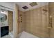 Luxurious tiled shower with rainfall shower head and multiple body sprayers at 10508 W Chautauga Mtn, Littleton, CO 80127