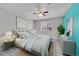 Inviting bedroom featuring a comfortable bed, soft lighting, and stylish furnishings at 9759 Lane St, Thornton, CO 80260