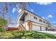 Townhouse exterior with attached garages, a fenced yard, and new landscaping at 9759 Lane St, Thornton, CO 80260