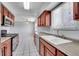Kitchen with double sink and view into breakfast nook area at 9759 Lane St, Thornton, CO 80260