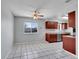 Kitchen with a breakfast nook area, featuring tiled floor and a window at 9759 Lane St, Thornton, CO 80260