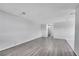 Spacious living room featuring wood-look floors and plenty of natural light at 9759 Lane St, Thornton, CO 80260