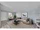 Bright living room with a comfortable neutral-toned couch and stylish black marble coffee table at 9759 Lane St, Thornton, CO 80260