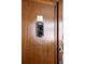 A wooden apartment door with a decorative mail slot cover and the number 301 on it at 1060 N Washington St # 301, Denver, CO 80203