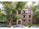 Charming brick apartment building with Tudor-style details and landscaped entrance at 1060 N Washington St # 301, Denver, CO 80203