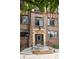 Brick building entrance with prominent address and decorative stone trim at 1060 N Washington St # 301, Denver, CO 80203