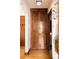 Hallway featuring a wooden storage cabinet and a view of the bathroom and another room at 1060 N Washington St # 301, Denver, CO 80203