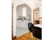 Well-lit kitchen featuring white cabinets and black and white patterned floors at 1060 N Washington St # 301, Denver, CO 80203