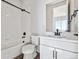 Modern bathroom with white tiles, sleek black fixtures, and a clean, contemporary design at 13710 Emerald Lake St, Parker, CO 80138
