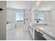 Bright bathroom featuring a large soaking tub, walk-in shower, and dual vanity with modern fixtures at 13710 Emerald Lake St, Parker, CO 80138