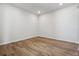 A light-filled empty bedroom featuring wood flooring and recessed lighting at 13710 Emerald Lake St, Parker, CO 80138