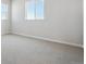 Clean bedroom features neutral walls, carpeted flooring, and abundant natural light through large windows at 13710 Emerald Lake St, Parker, CO 80138