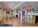 Entertaining basement featuring a pool table, bar area, pinball, and hardwood floors at 32091 Black Widow Dr, Conifer, CO 80433