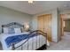 Charming bedroom with a decorative metal frame bed, closet, and an inviting atmosphere at 32091 Black Widow Dr, Conifer, CO 80433