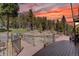 Enjoy this tranquil wooden deck and fenced in area with rock landscaping and beautiful forest views at 32091 Black Widow Dr, Conifer, CO 80433