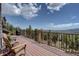 Entertain or relax on this home's spacious deck and enjoy amazing mountain views in the distance at 32091 Black Widow Dr, Conifer, CO 80433