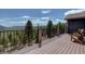 Relax on this home's spacious deck and enjoy amazing views of trees and mountains in the distance at 32091 Black Widow Dr, Conifer, CO 80433