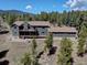 Lovely home on wooded lot features multi-level decks offering great views, ample space and a tranquil outdoor experience at 32091 Black Widow Dr, Conifer, CO 80433