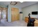 A spare room set up as an office area with large closet and open doorway to another room at 32091 Black Widow Dr, Conifer, CO 80433