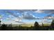 Picturesque mountain view featuring a vibrant sky over rolling hills and lush greenery at 32091 Black Widow Dr, Conifer, CO 80433