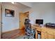 This is a simple, well-lit office space featuring a practical desk with drawers and a comfortable ergonomic chair at 32091 Black Widow Dr, Conifer, CO 80433