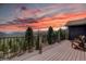 Expansive deck offers stunning views of the mountains and sunset at 32091 Black Widow Dr, Conifer, CO 80433