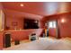 Basement room with large screen, carpet and sound system perfect for home theater, featuring a warm, inviting ambiance at 32091 Black Widow Dr, Conifer, CO 80433