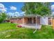 The backyard has a covered patio that extends the living space outdoors, and a well-maintained lawn at 10784 Allendale Dr, Arvada, CO 80004