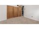 Unfinished basement with carpet, storage, and utilities at 10784 Allendale Dr, Arvada, CO 80004