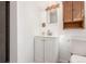 Bathroom showcasing vanity, fixtures, and storage at 10784 Allendale Dr, Arvada, CO 80004