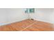 Empty room with window and hardwood floors at 10784 Allendale Dr, Arvada, CO 80004