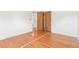 Empty bedroom featuring hardwood floors and white trim at 10784 Allendale Dr, Arvada, CO 80004