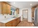Functional kitchen featuring ample cabinet space, stainless steel appliances, and a bright window for natural light at 10784 Allendale Dr, Arvada, CO 80004