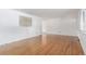 Clean and airy living room boasting wood floors, neutral walls, and a minimalist aesthetic perfect for relaxation at 10784 Allendale Dr, Arvada, CO 80004