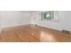 Bright living room featuring wood floors, a large window and a neutral color palette offering a clean and inviting space at 10784 Allendale Dr, Arvada, CO 80004